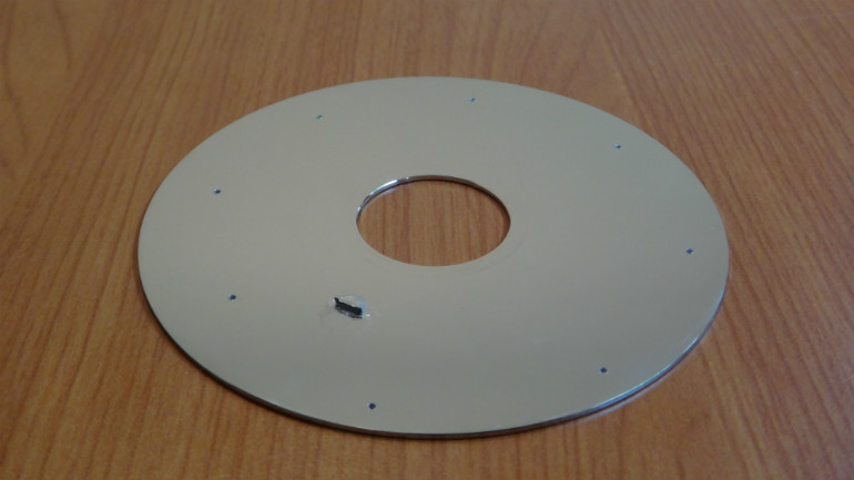 holes and glued neodymium magnet